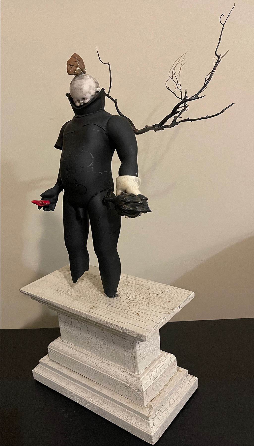 Exxon Angel; 21 x 9 x 14; ceramic. coral, leather, pigment and wood; 2017